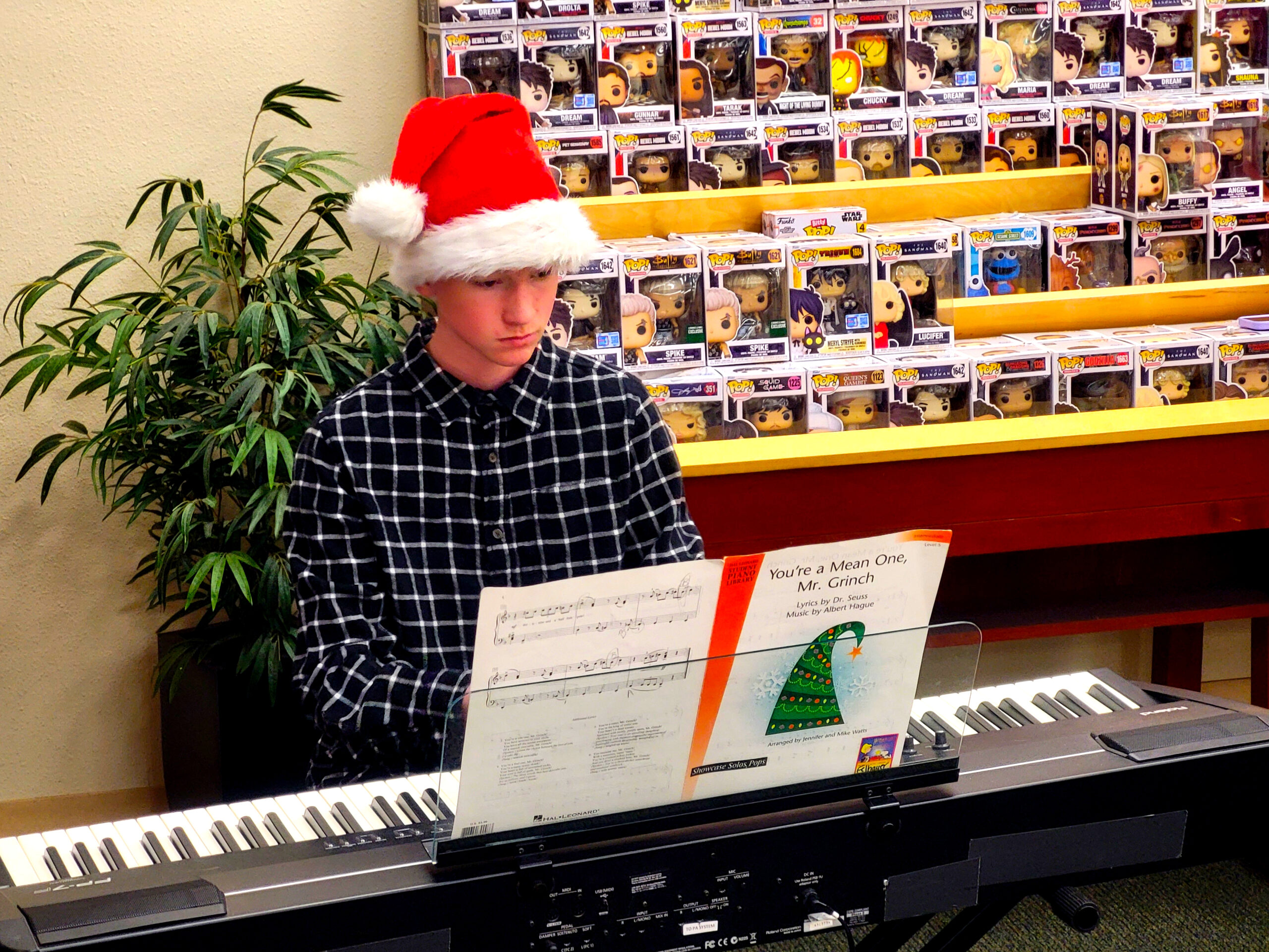 Lee playing piano for a funko pop audience